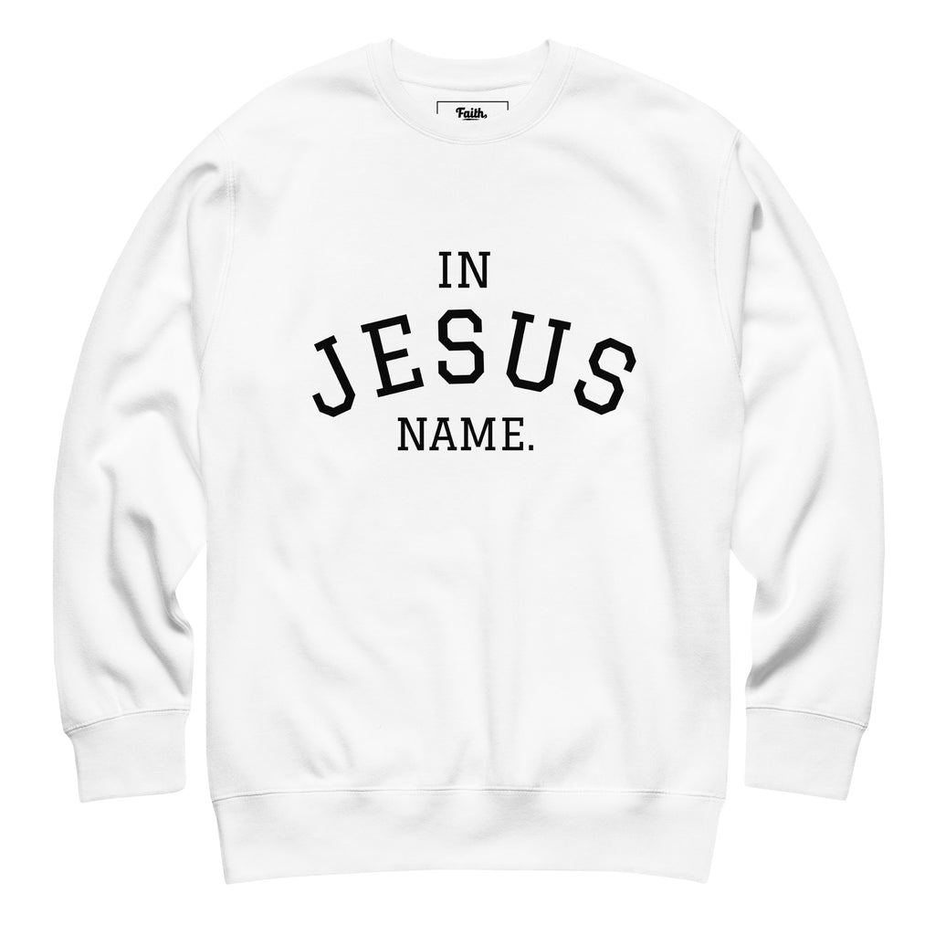 White sweatshirt with 'IN JESUS NAME' text 